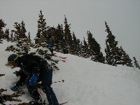 Playing in steep trees....Ken above Gene